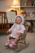 Annabel in a dolls chair