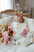 Brooke asleep on soft toys