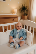 Carl in a cot