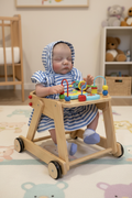 Reborn doll in baby walker